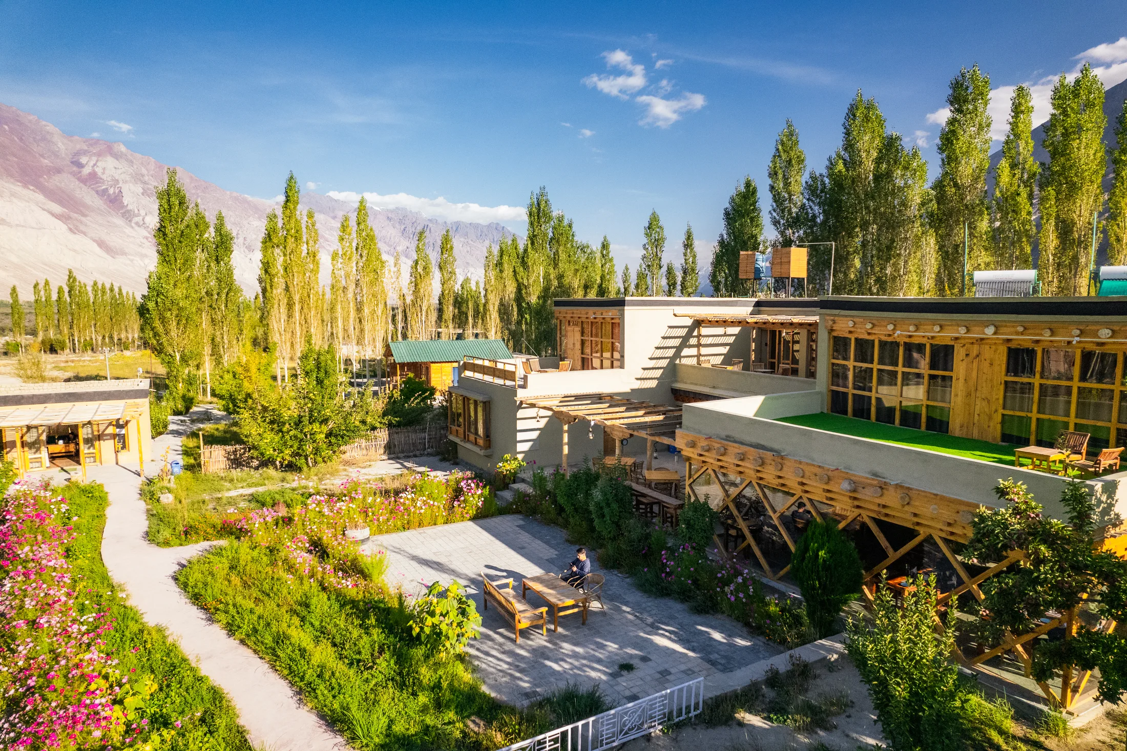 Nubra Ecolodge gardens and mountain setting